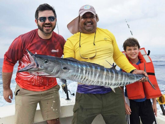 father and son deep sea fishing